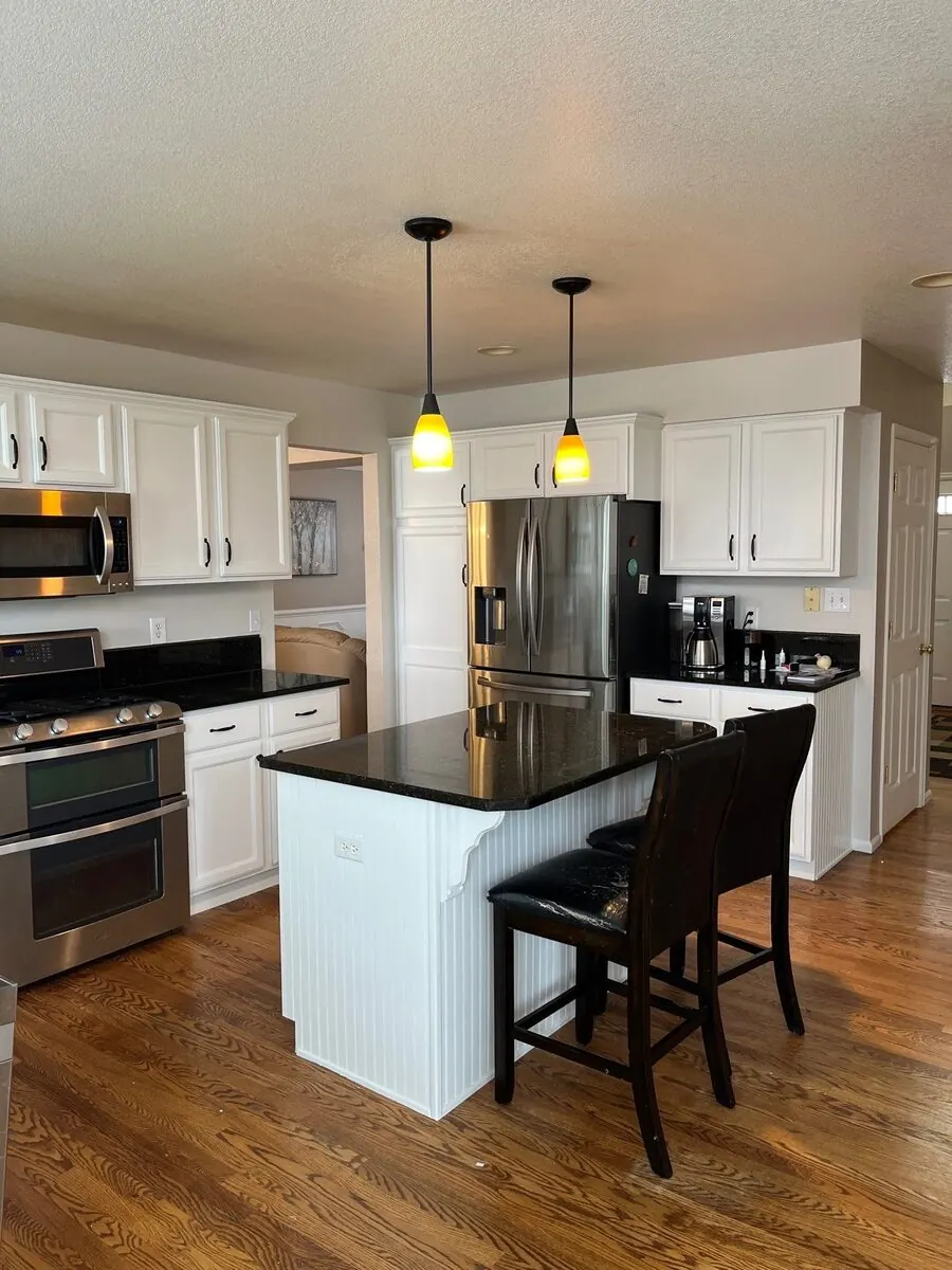 Denver kitchen cabinets after repainting by Kind Home Painting