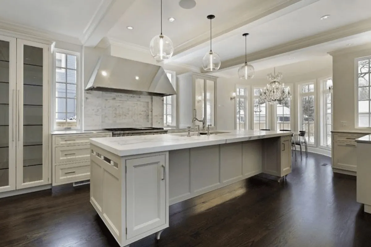 Bright white repainted kitchen with large island